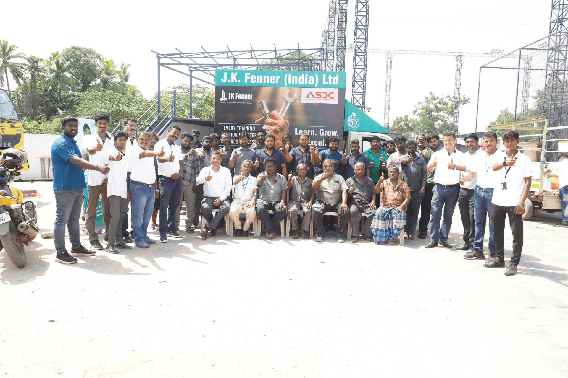 JK Fenner van campaign project with mechanics and field teams